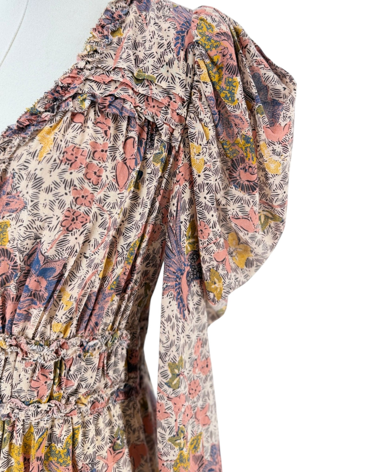 Floral Long sleeve v-neck mini dress on a mannequin on a white background