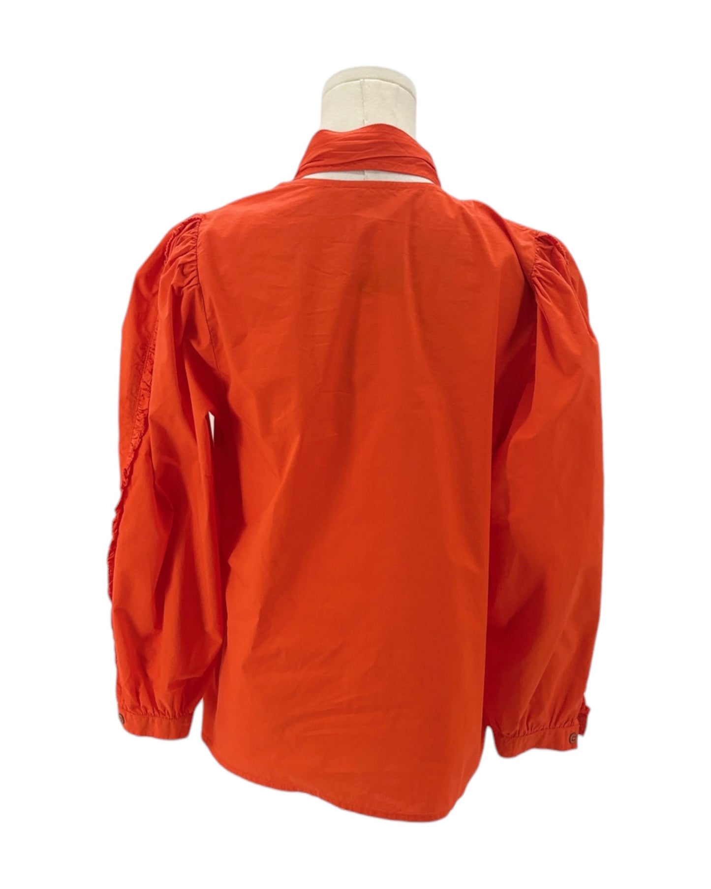 Orange jacket on a mannequin against a white background