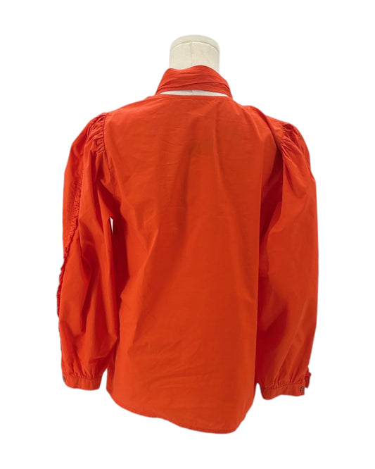 Orange jacket on a mannequin against a white background