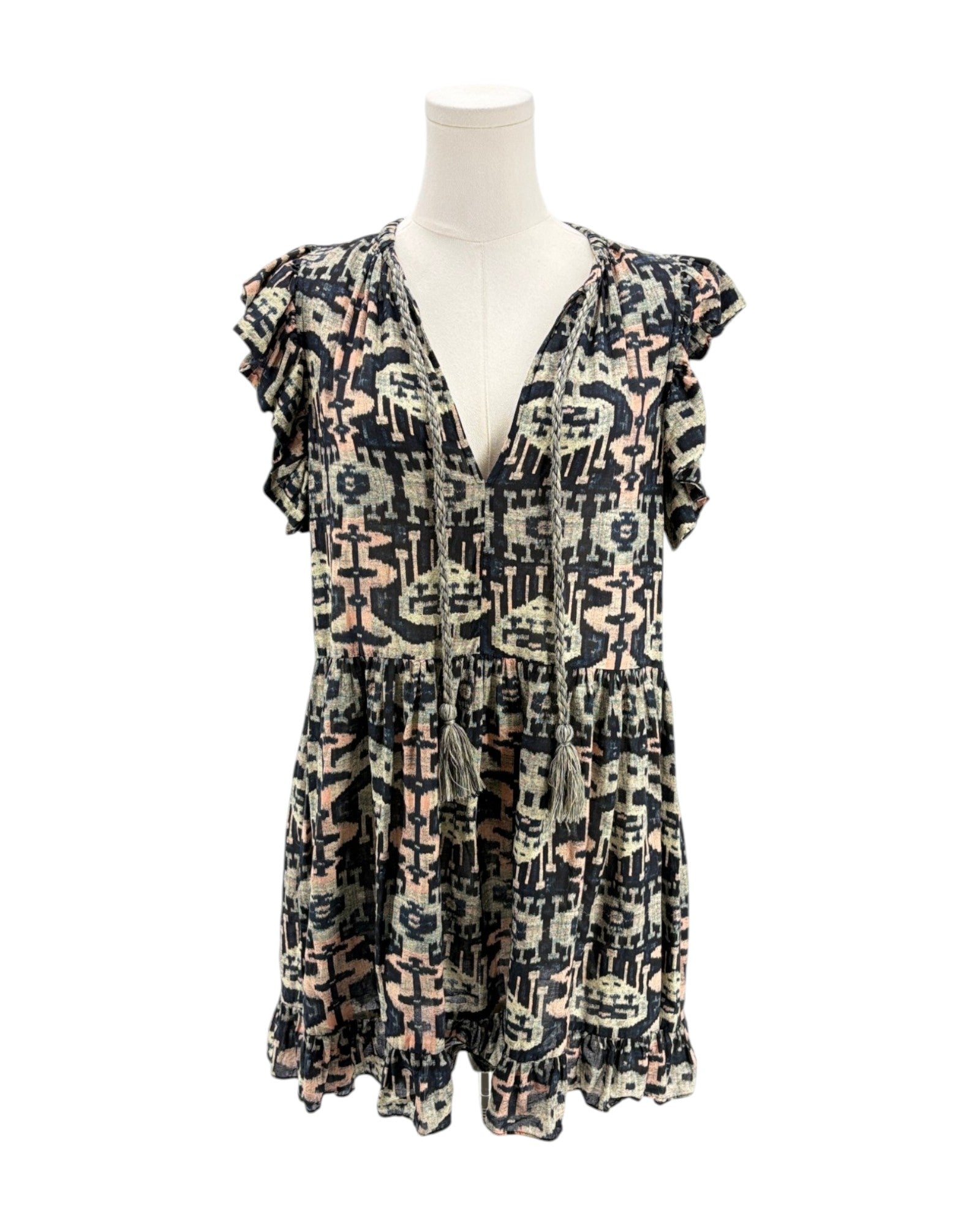 Patterned dress on a mannequin against a white background