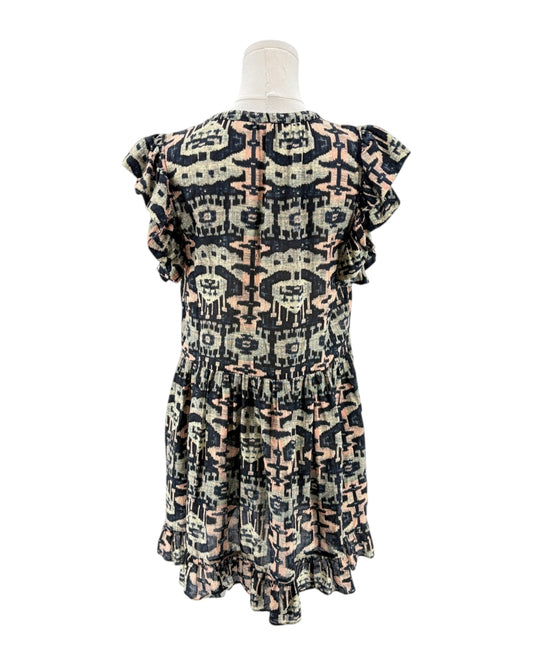 Patterned dress on a mannequin against a white background