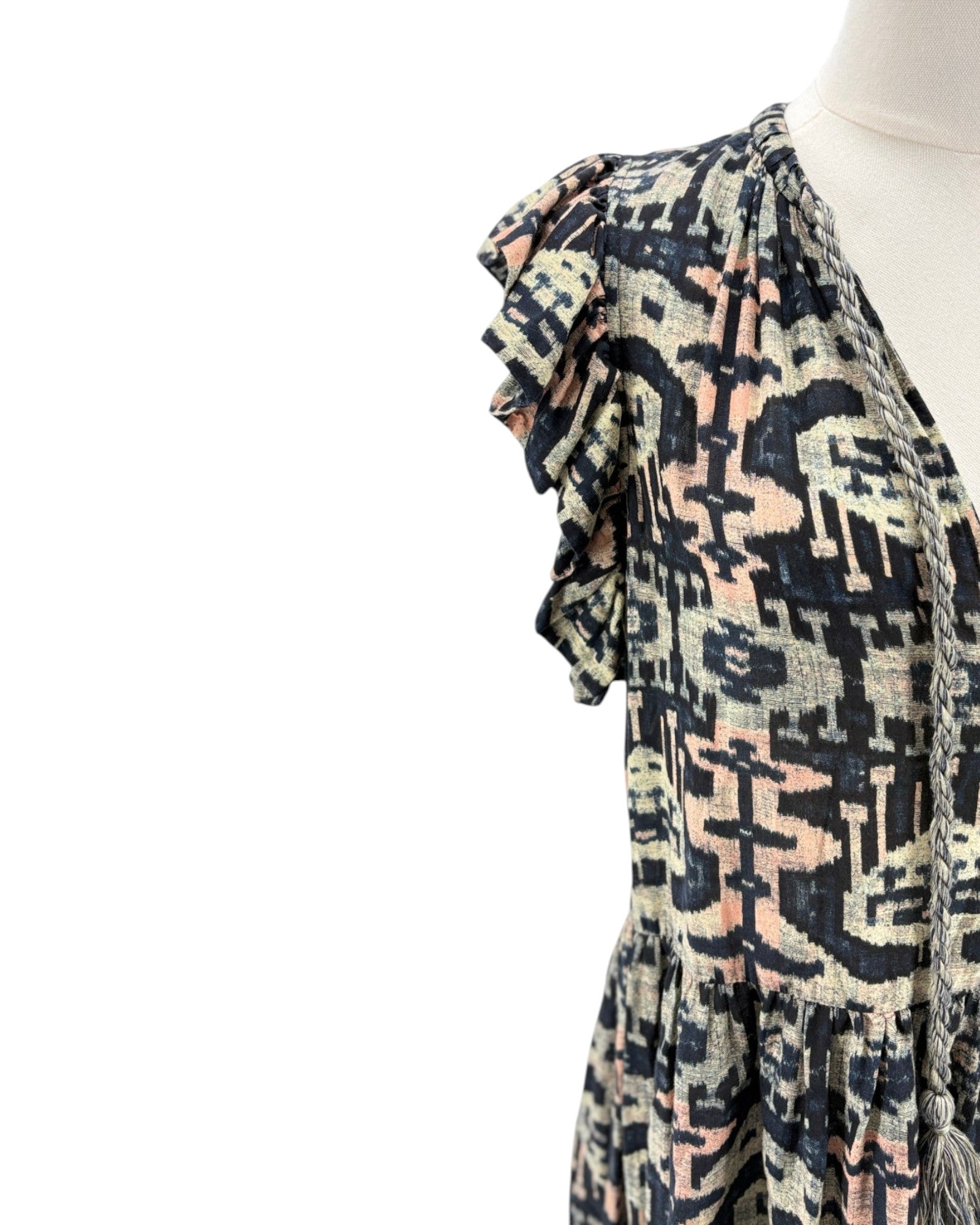 Patterned scarf on a mannequin against a white background
