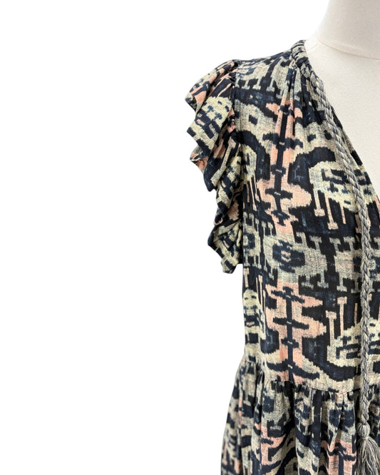 Patterned scarf on a mannequin against a white background