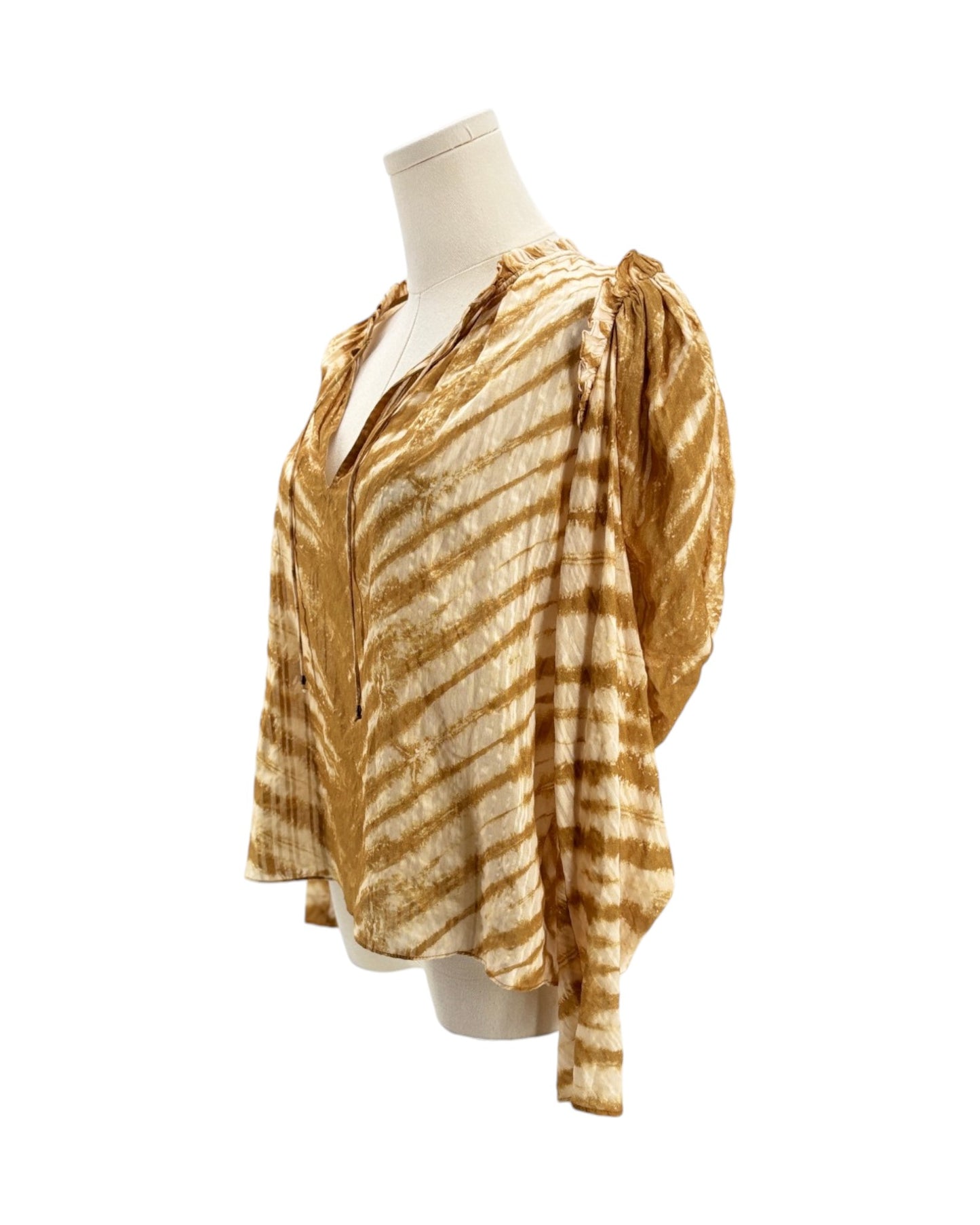 Mannequin wearing a gold and white striped blouse on a white background