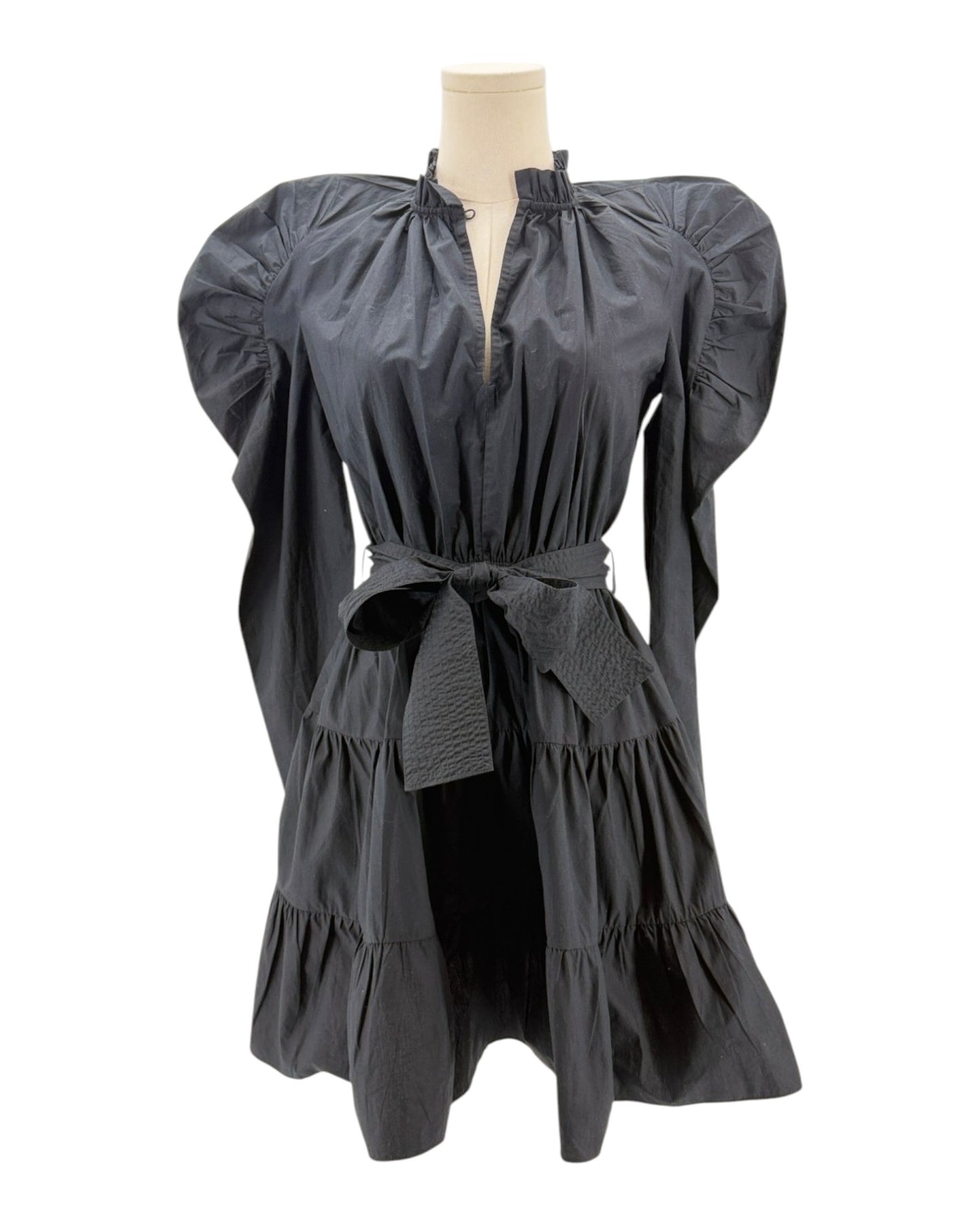 Black dress with puff sleeves on a mannequin against a white background