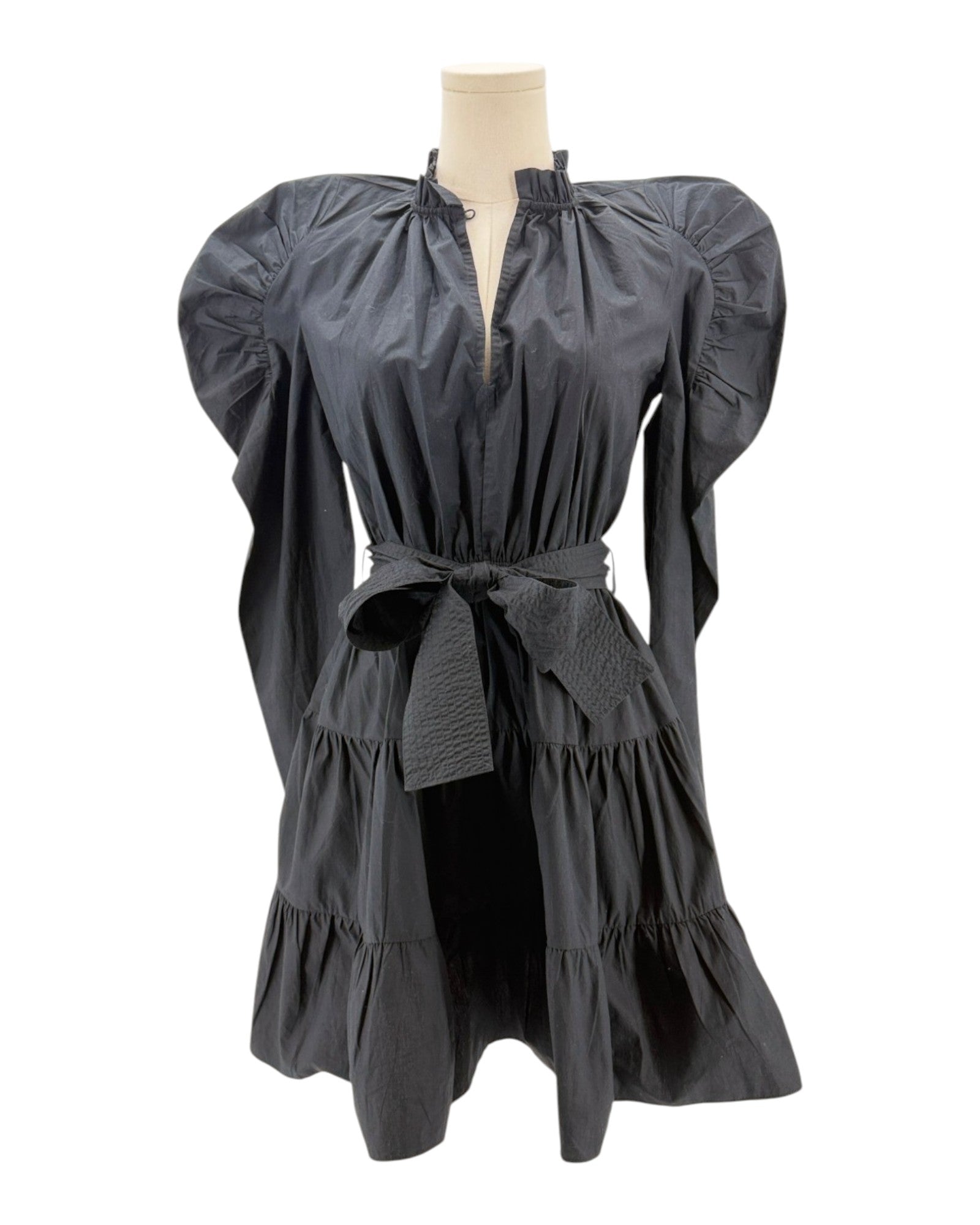 Black dress with puff sleeves on a mannequin against a white background