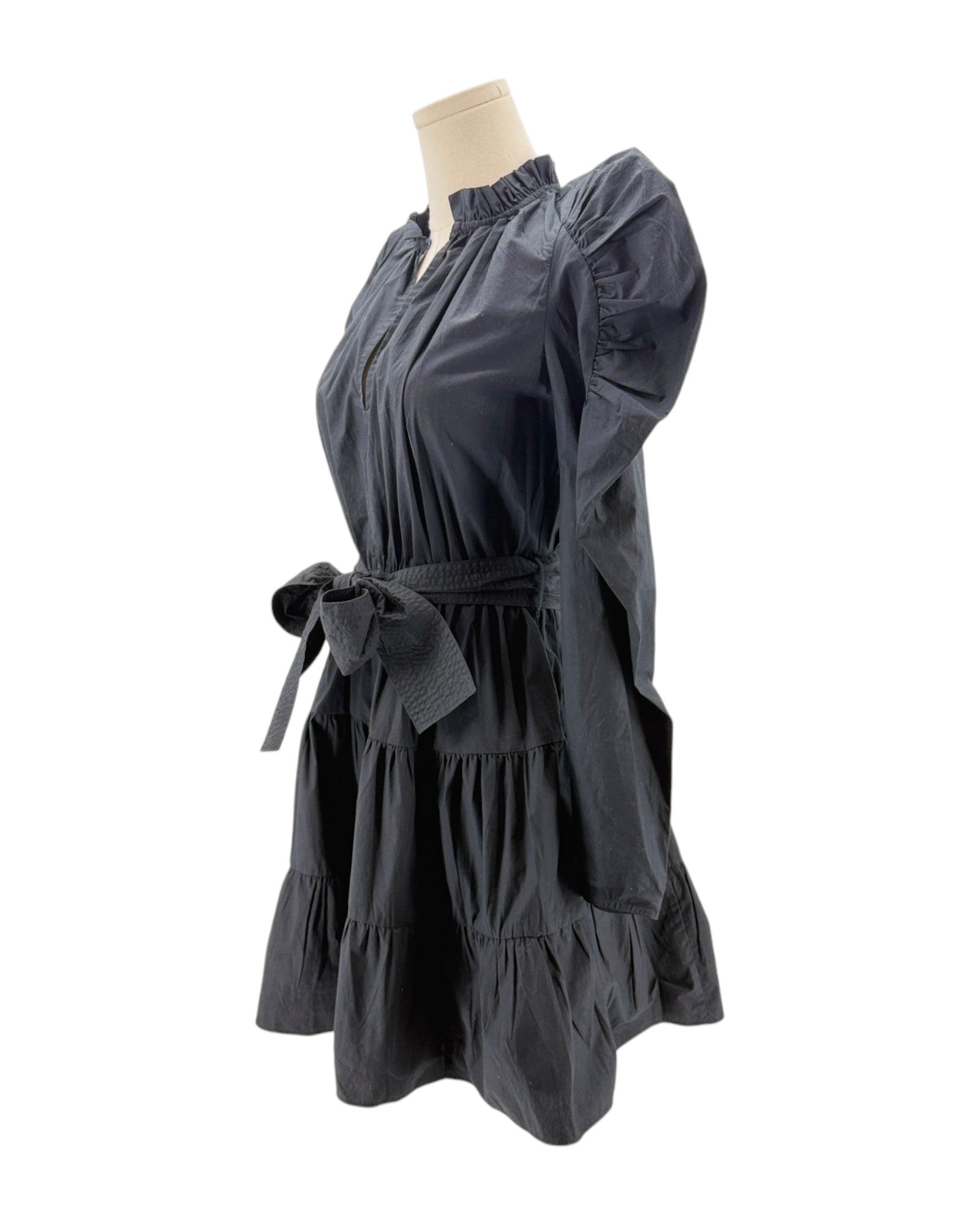 Dark gray dress on a mannequin against a white background