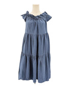 Blue dress on a mannequin against a white background