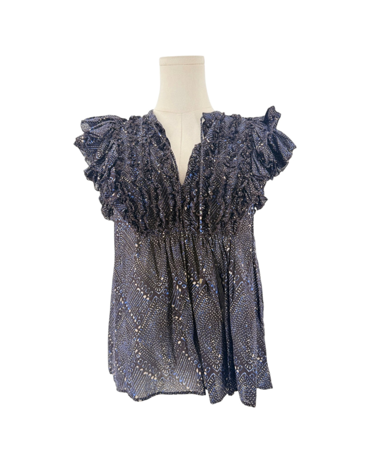Short sleeve mulberry diamond print, tiered ruffle sleeves, smocked detailing along the split v-neckline, drawstring tassel accent on a mannequin on a white background