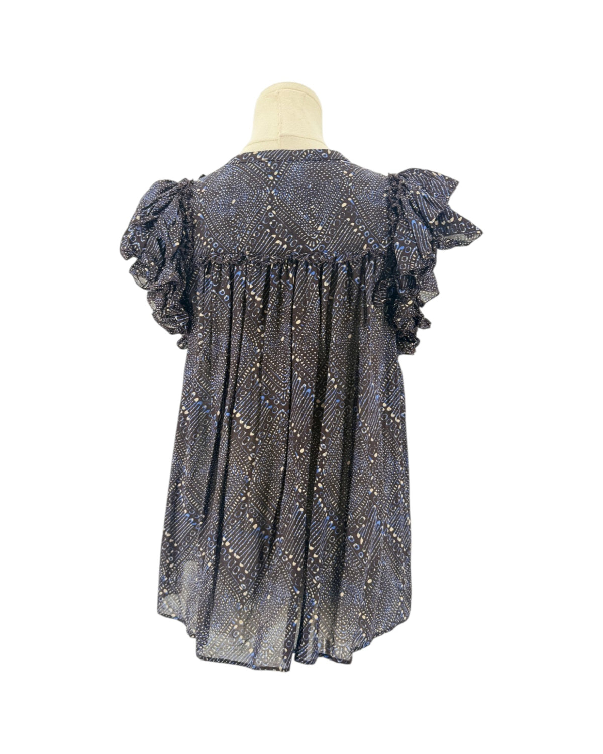 Short sleeve mulberry diamond print, tiered ruffle sleeves, smocked detailing along the split v-neckline, drawstring tassel accent on a mannequin on a white background