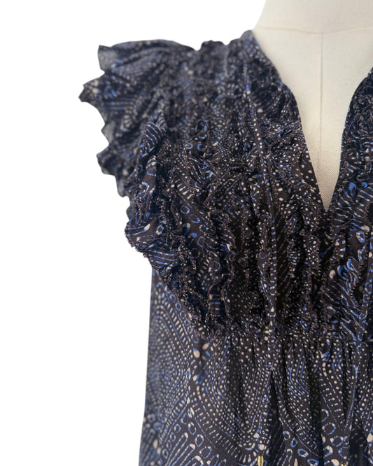 Short sleeve mulberry diamond print, tiered ruffle sleeves, smocked detailing along the split v-neckline, drawstring tassel accent on a mannequin on a white background