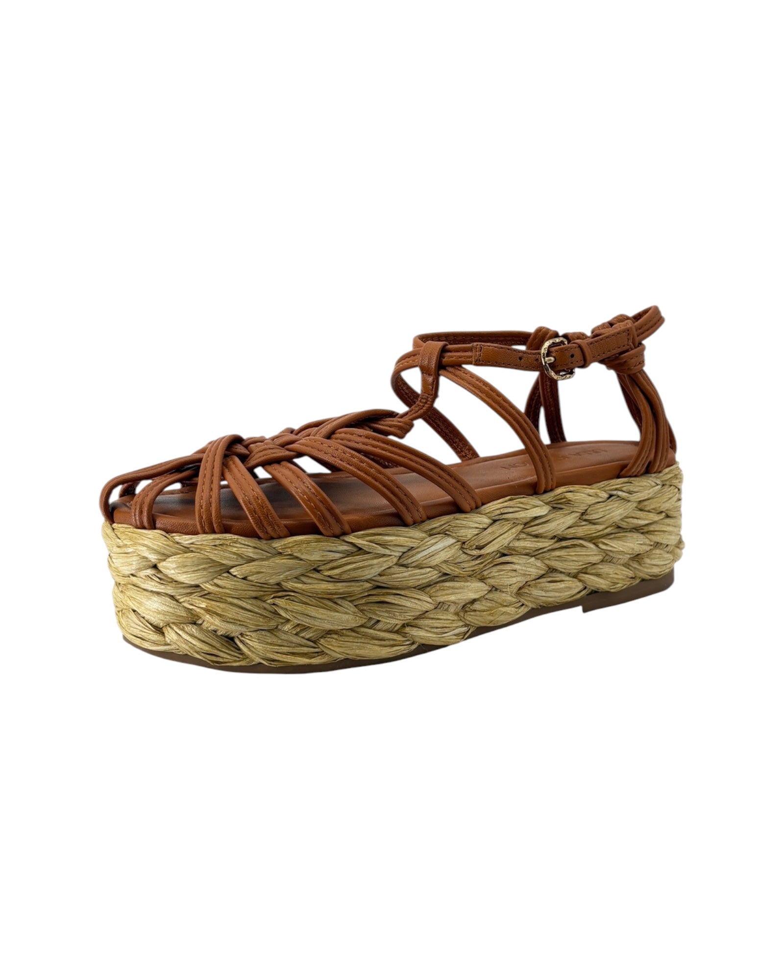 Brown sandal with woven platform on a white background
