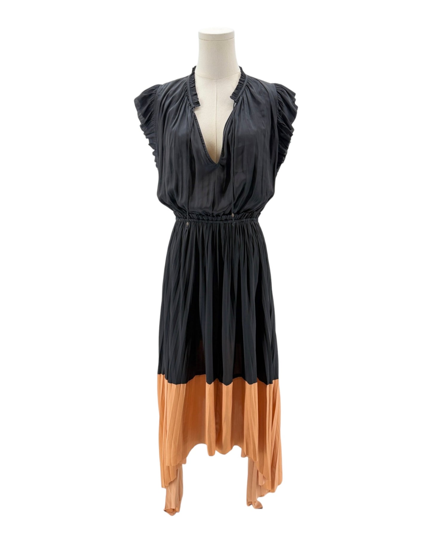Mannequin wearing a black and orange dress on a white background