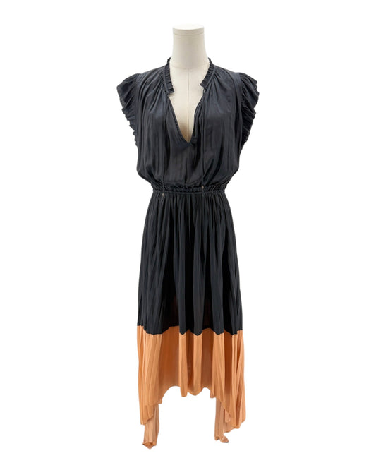 Mannequin wearing a black and orange dress on a white background