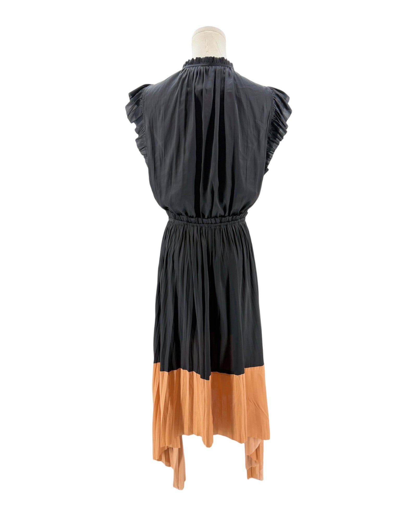 Black and orange dress on a mannequin against a white background