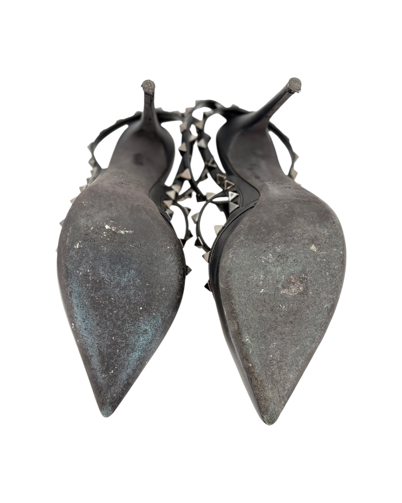Pair of dark gray earrings with pointed design on a white background