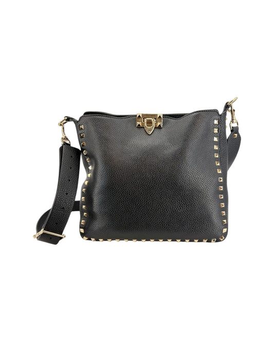 Black leather handbag with gold accents on a white background