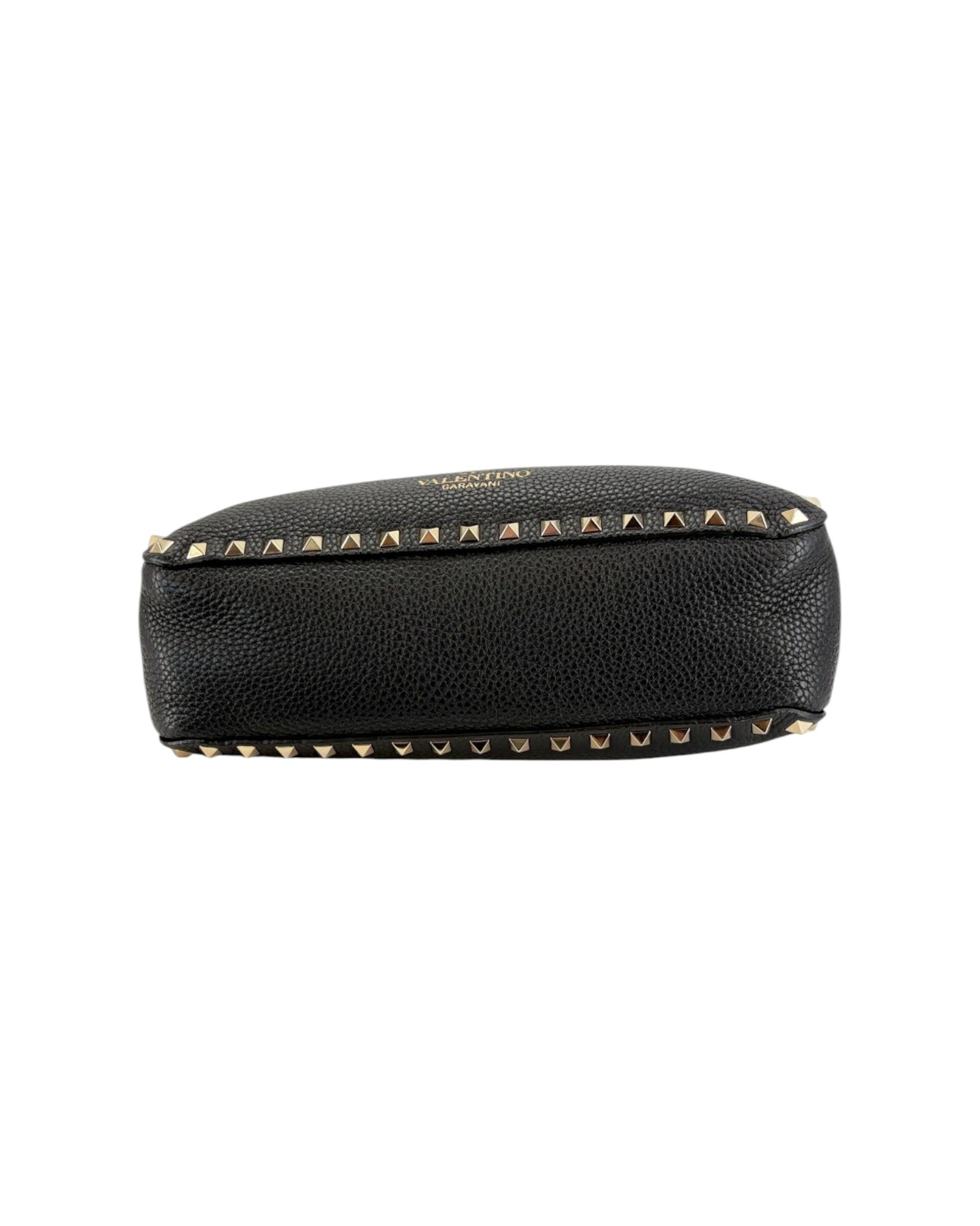 Black leather pouch with gold studs on a white background