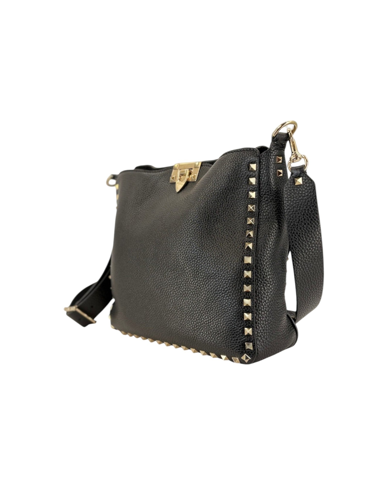 Black leather handbag with gold studs on a white background