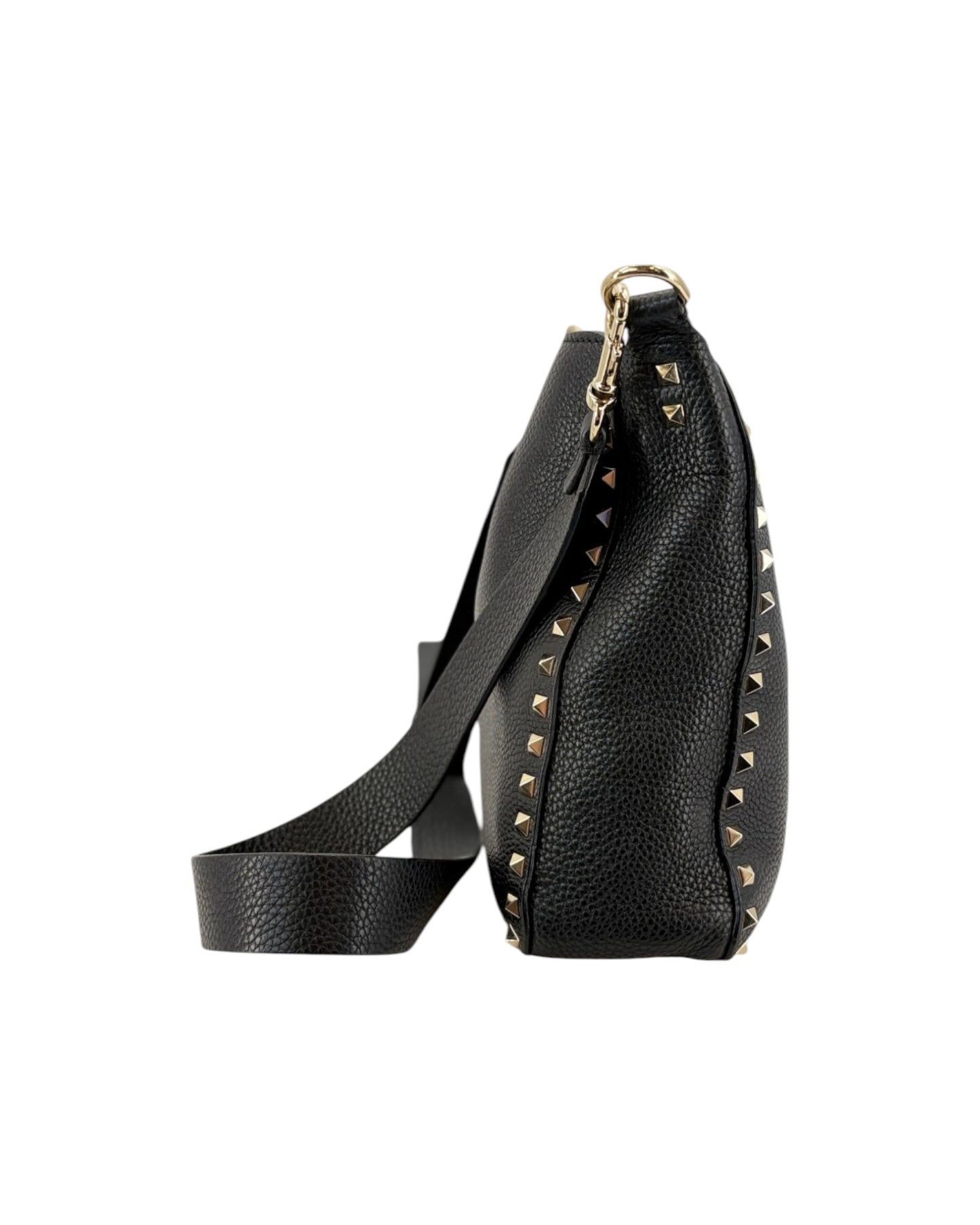 Black leather bag with gold studs on a white background