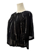 Black top with silver embellishments on a mannequin against a white background