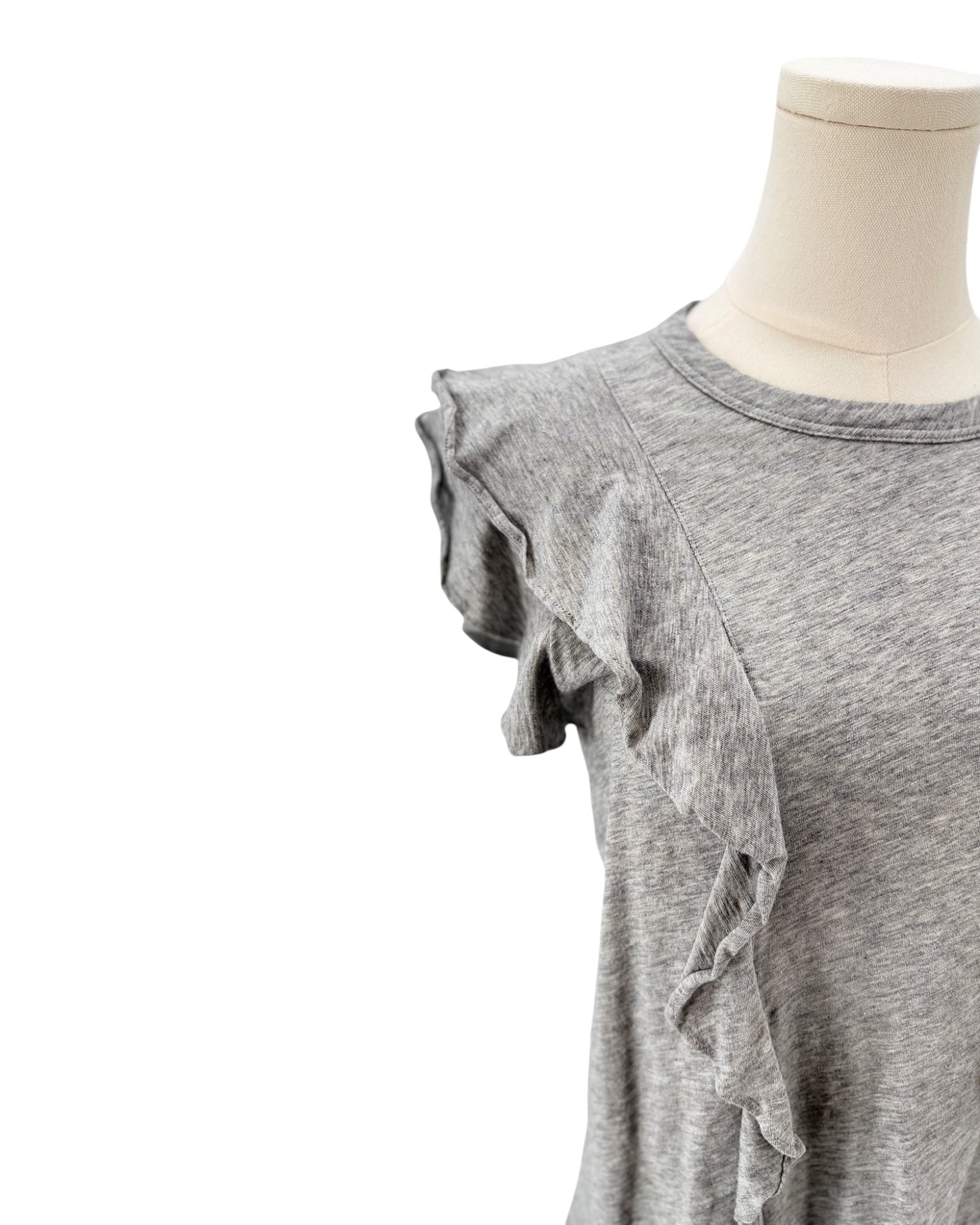 Gray ruffled top on a mannequin against a white background