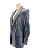 Blue leather blazer on a mannequin against a white background