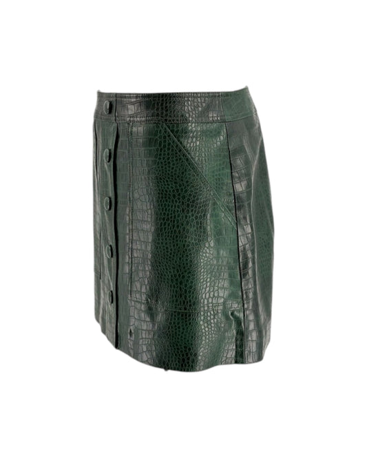 Green leather skirt with crocodile texture on a white background