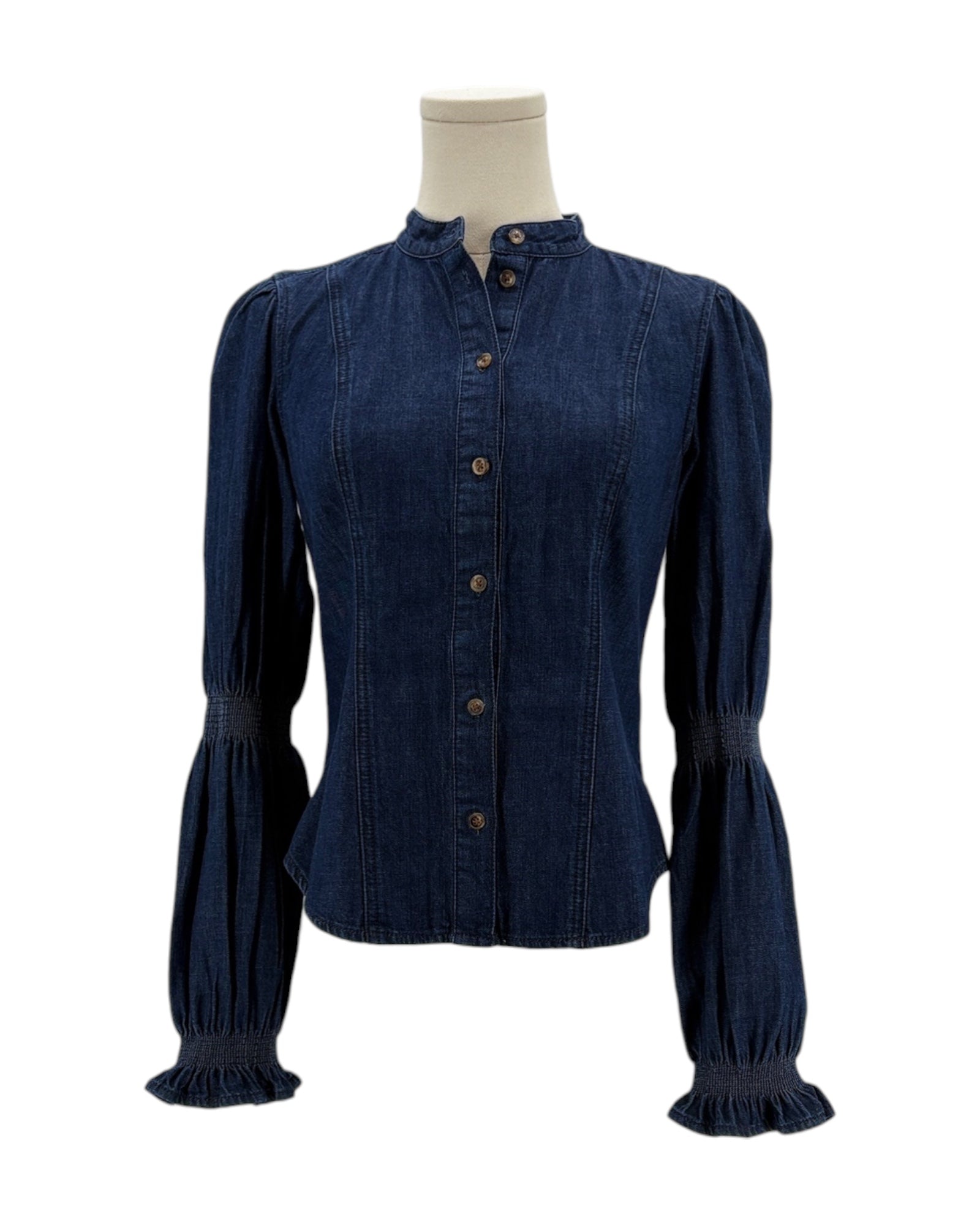 Denim blouse on a mannequin against a white background
