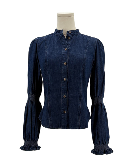 Denim blouse on a mannequin against a white background