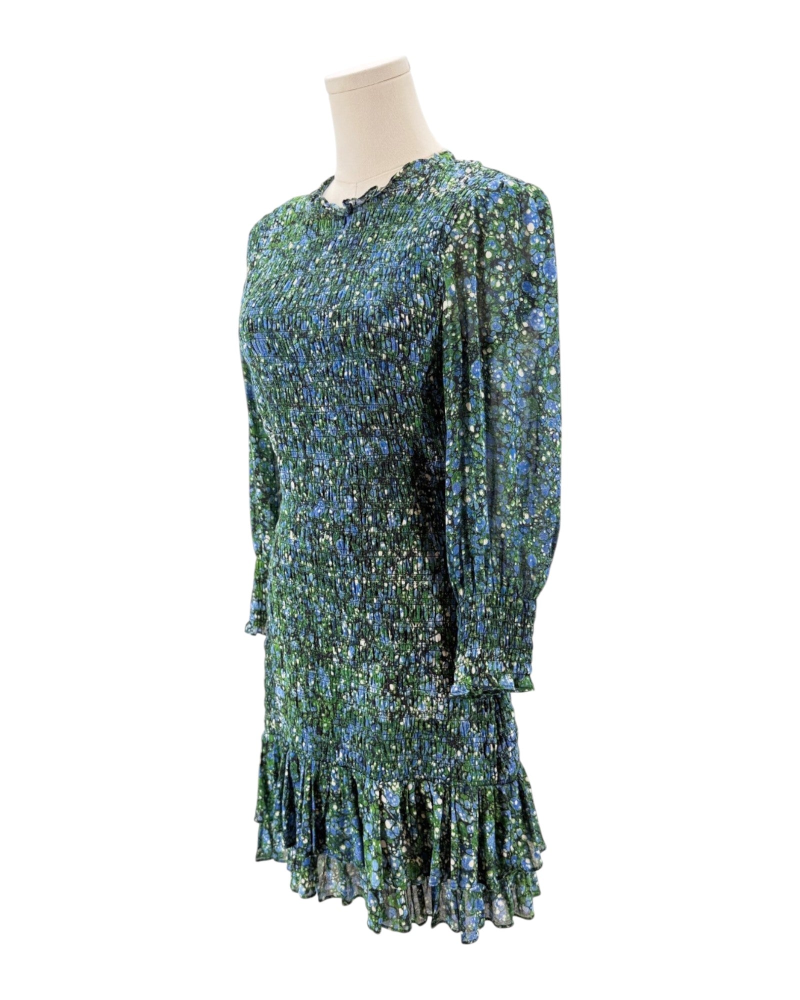 Floral dress on a mannequin against a white background