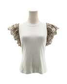 White top with lace sleeves on a mannequin against a white background