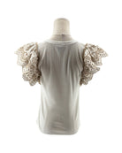 White blouse with lace sleeves on a mannequin against a white background