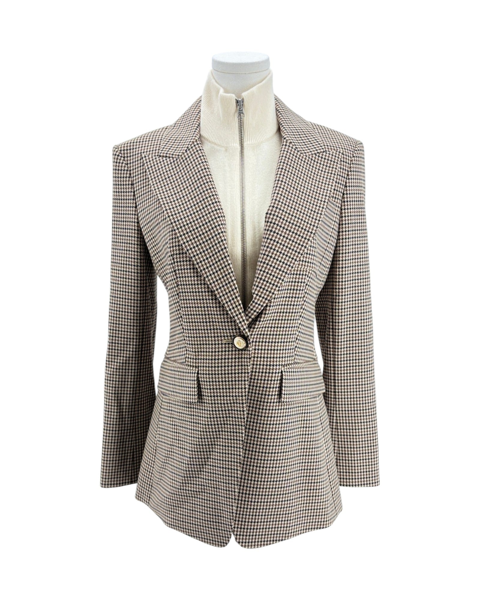 Houndstooth pattern blazer on a mannequin against a white background