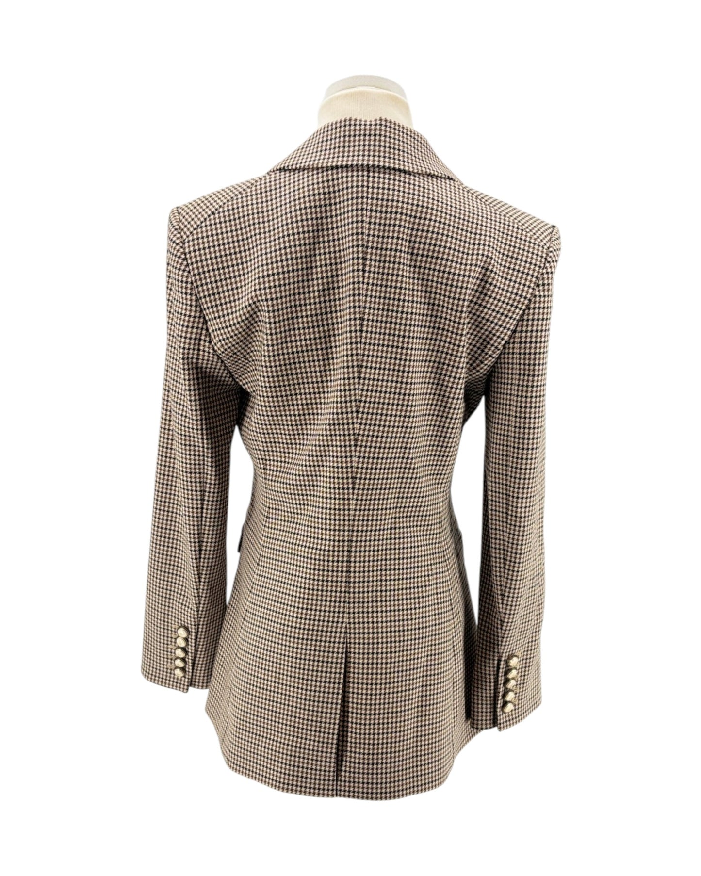 Houndstooth patterned blazer on a mannequin against a white background