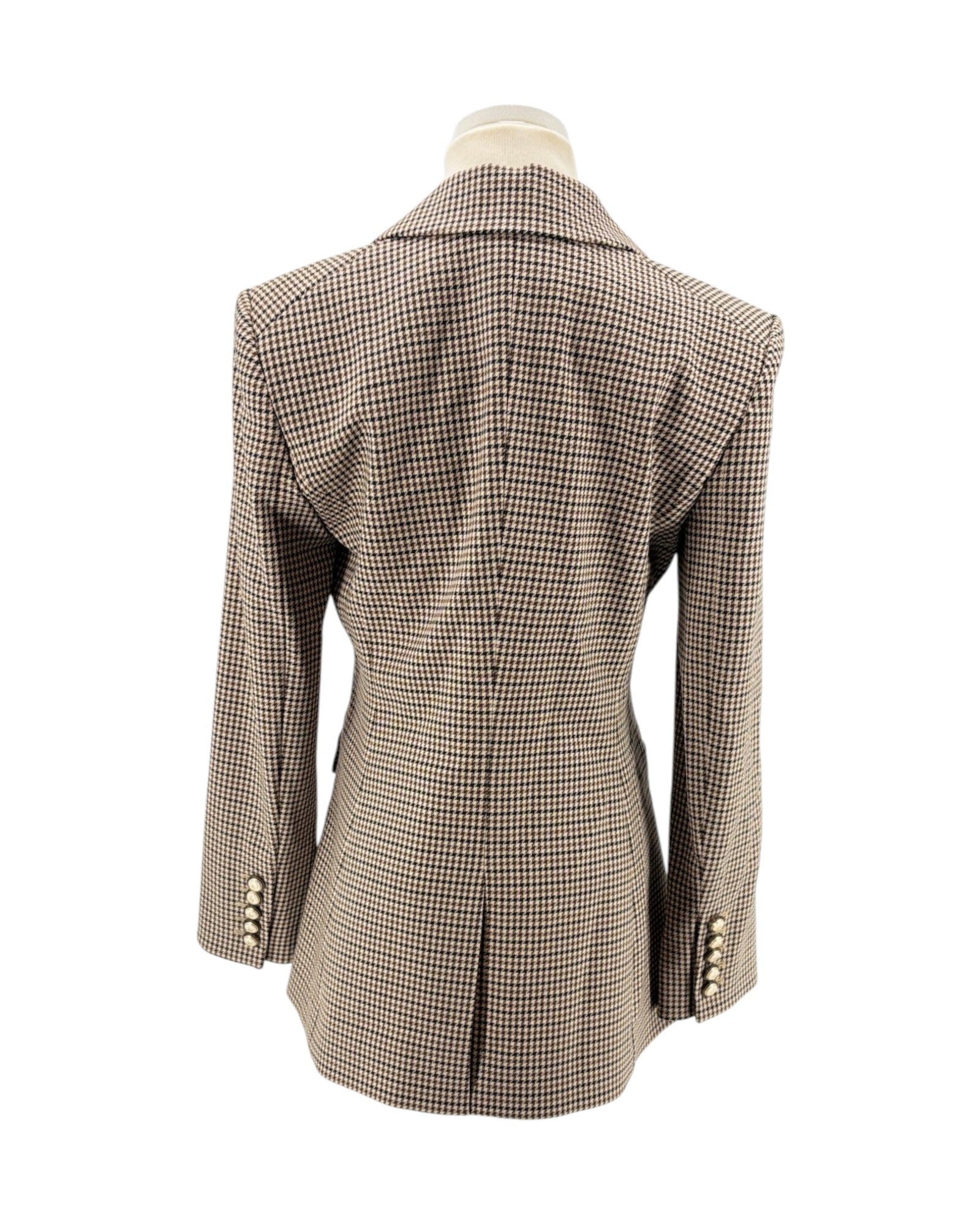 Houndstooth patterned blazer on a mannequin against a white background