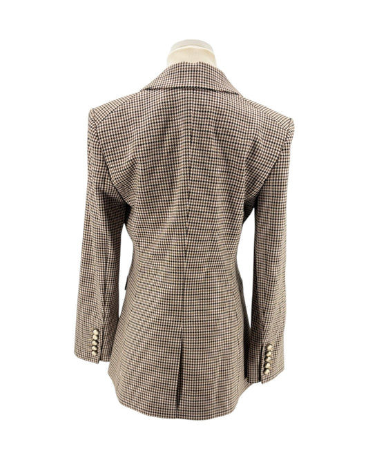 Houndstooth patterned blazer on a mannequin against a white background