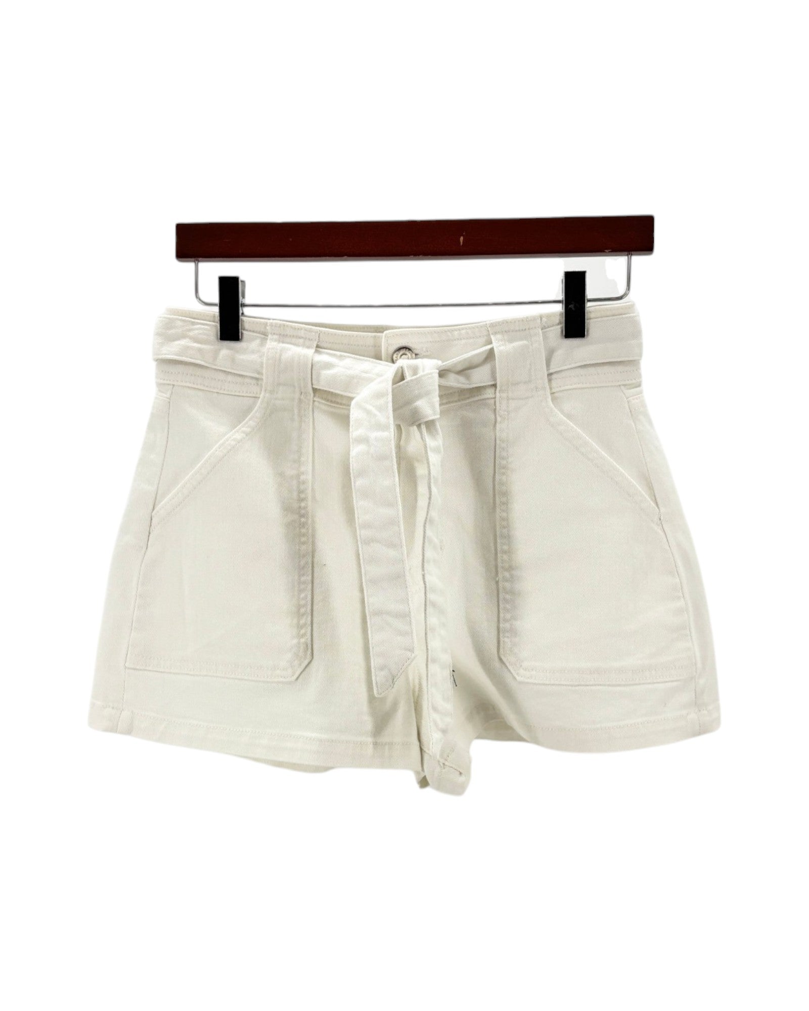 white shorts on a hanger against a white background