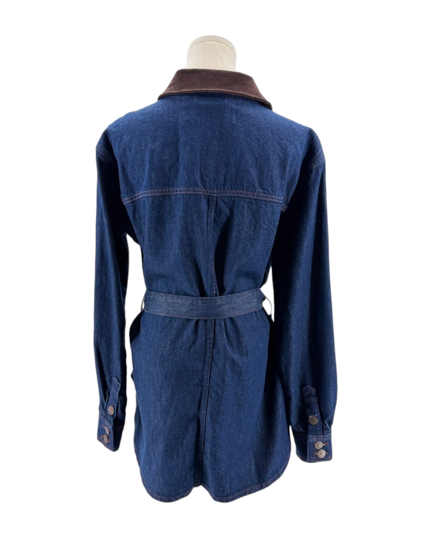 Blue denim jacket on a mannequin with a white background