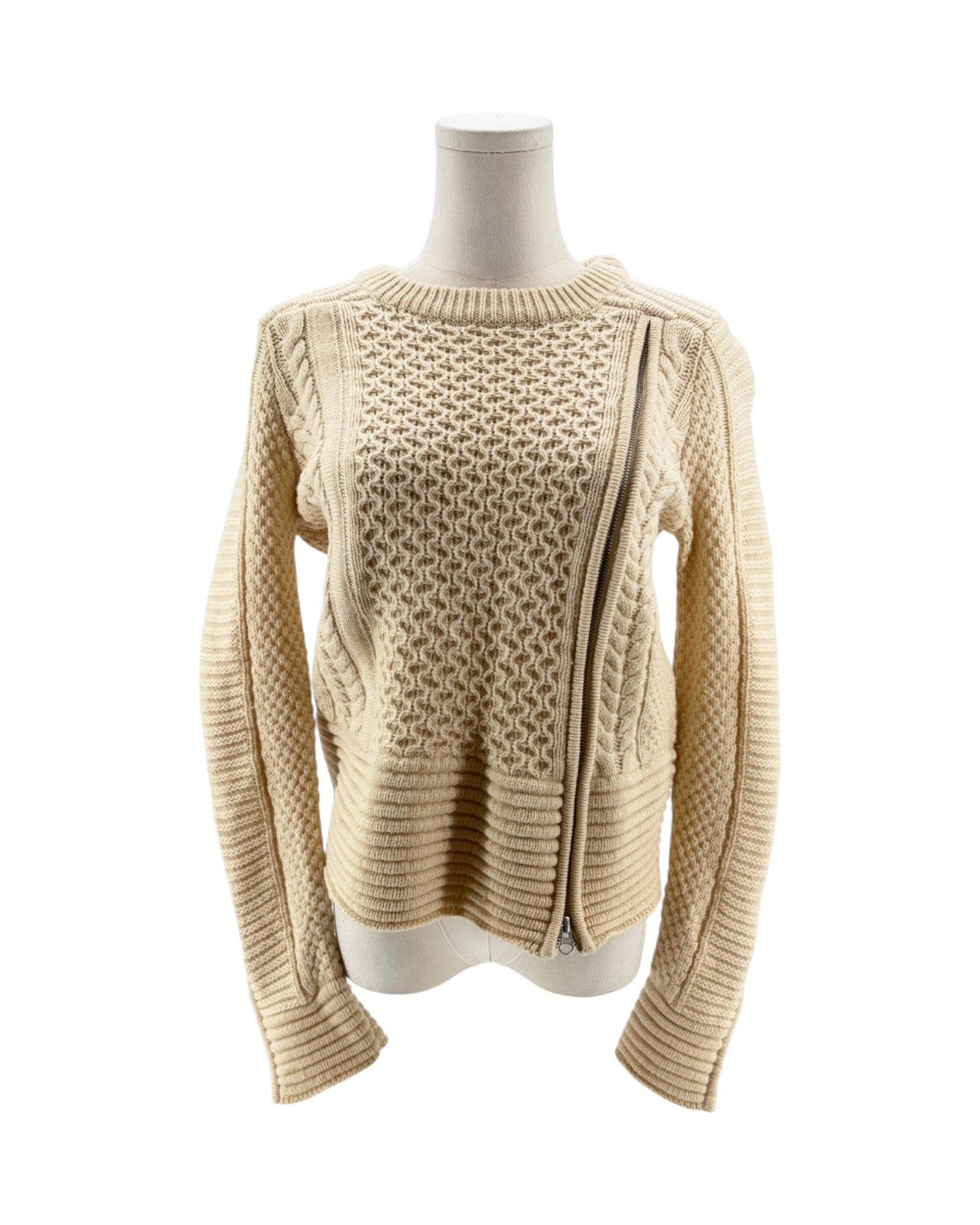 Beige knitted sweater on a mannequin against a white background