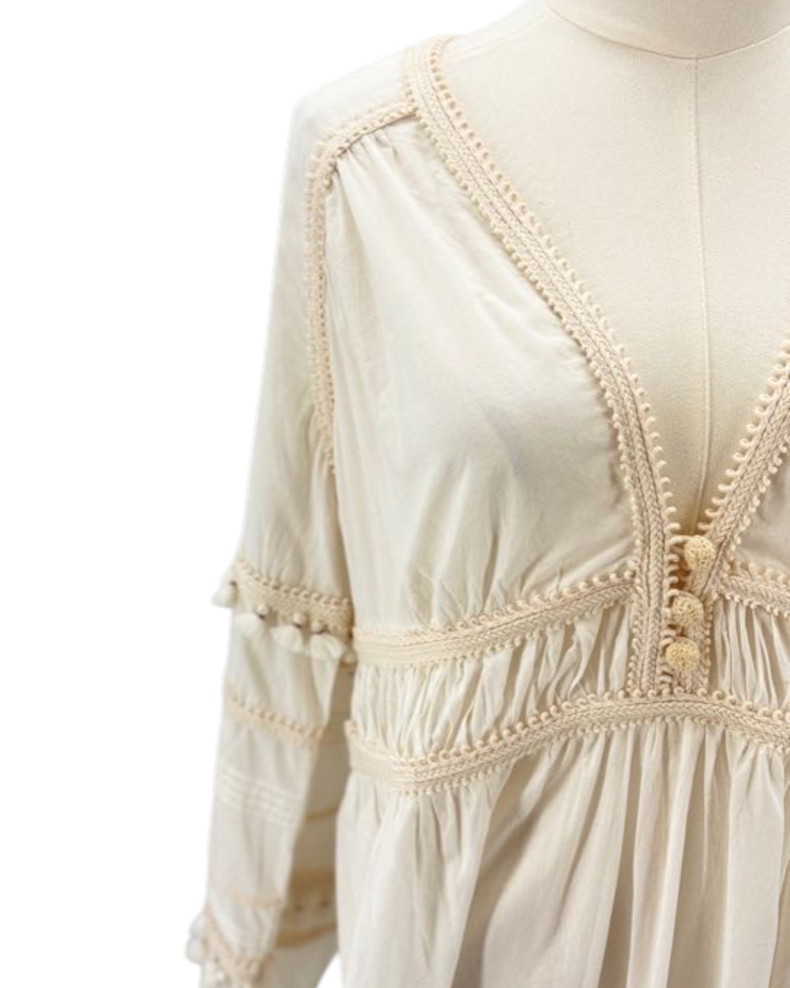Veronica Beard cream dress on a mannequin against a white background