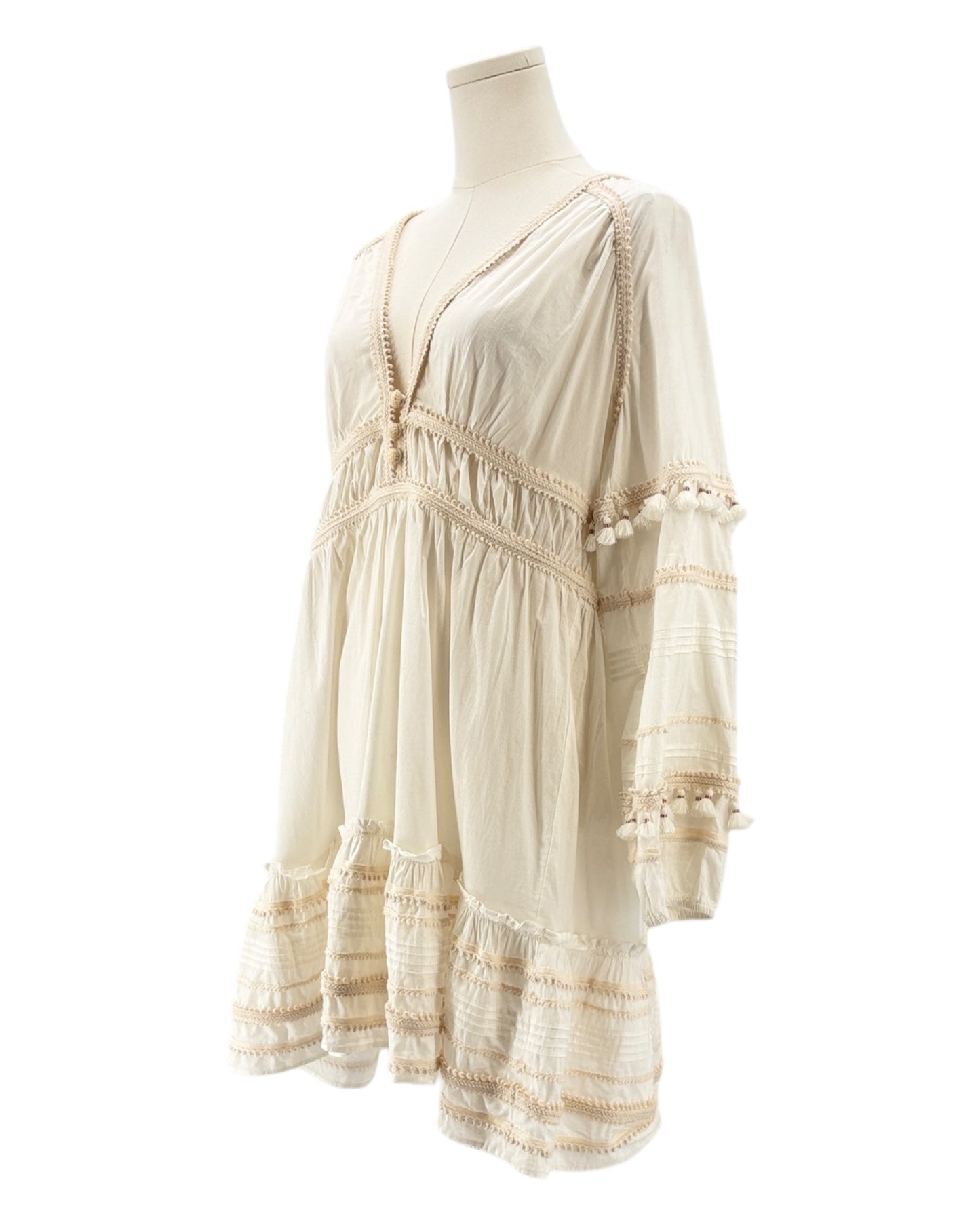 Veronica Beard cream dress on a mannequin against a white background