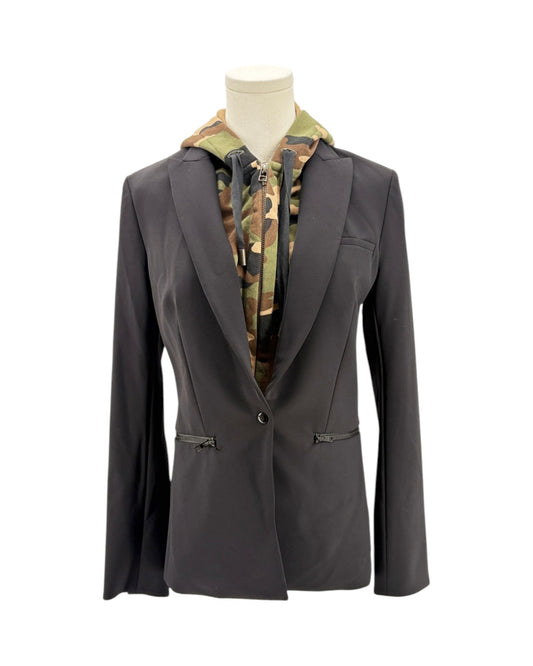 Black blazer with camouflage patterned shirt on a mannequin against a white background