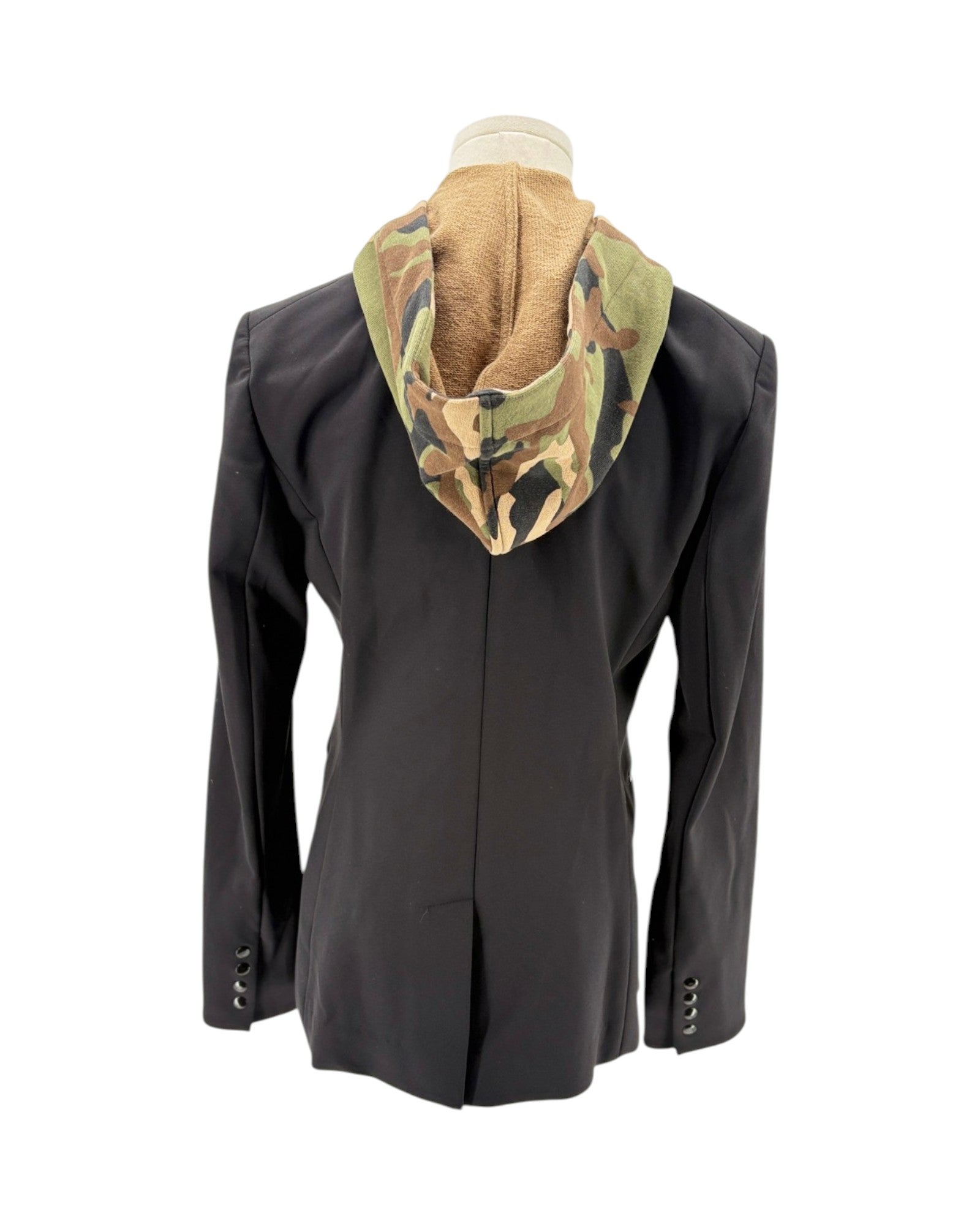 Black jacket with camouflage hood on a mannequin against a white background