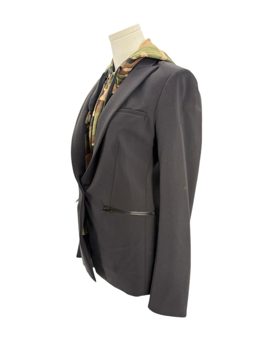 Black blazer on a mannequin with a camouflage pattern against a white background