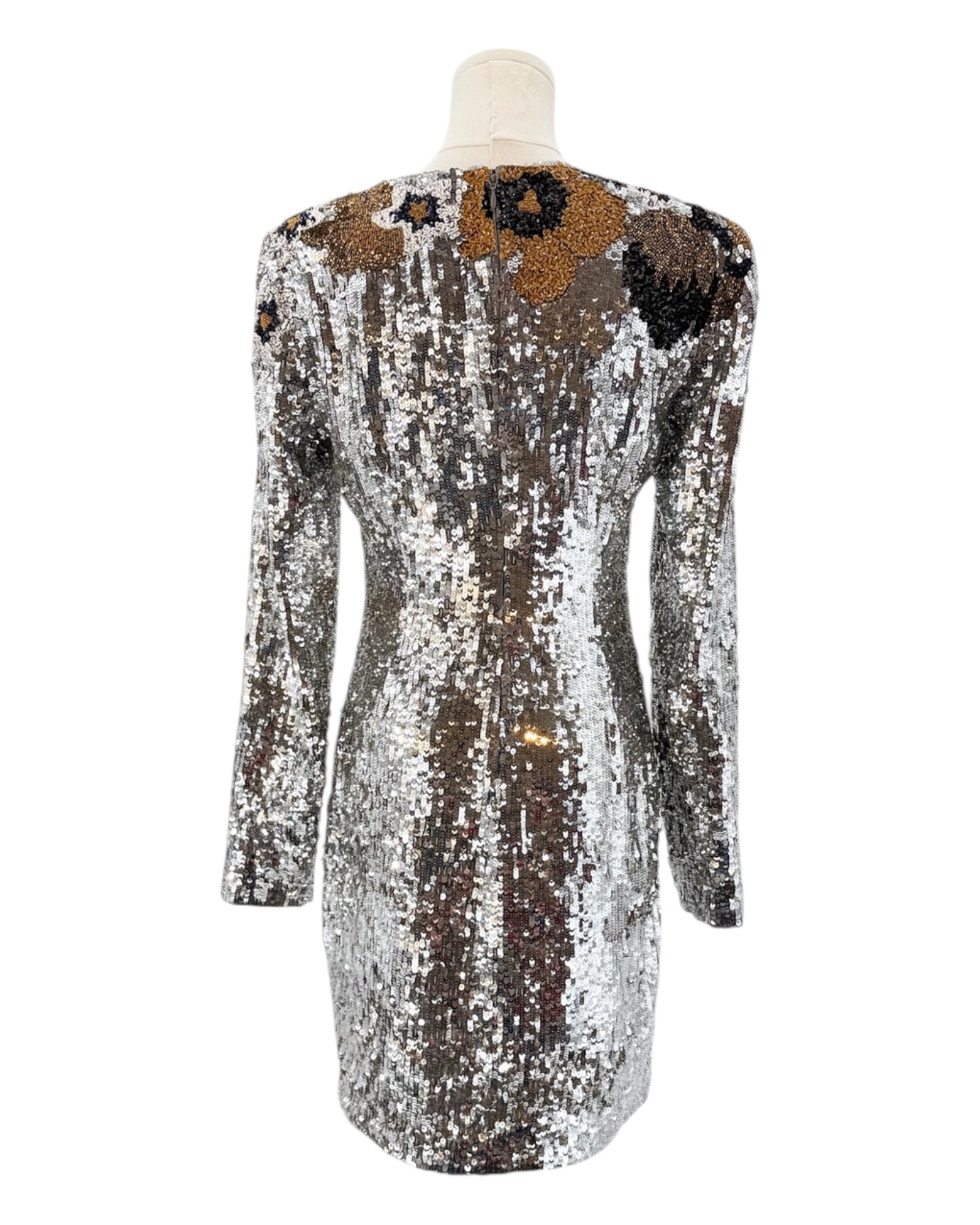 Silver sequin dress with black and brown floral patterns on a mannequin against a white background