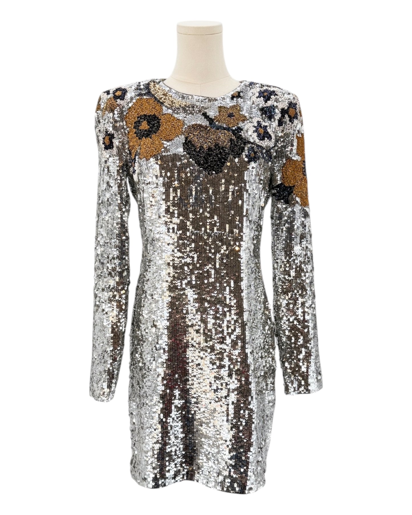 Silver sequin dress with floral patterns on a mannequin against a white background