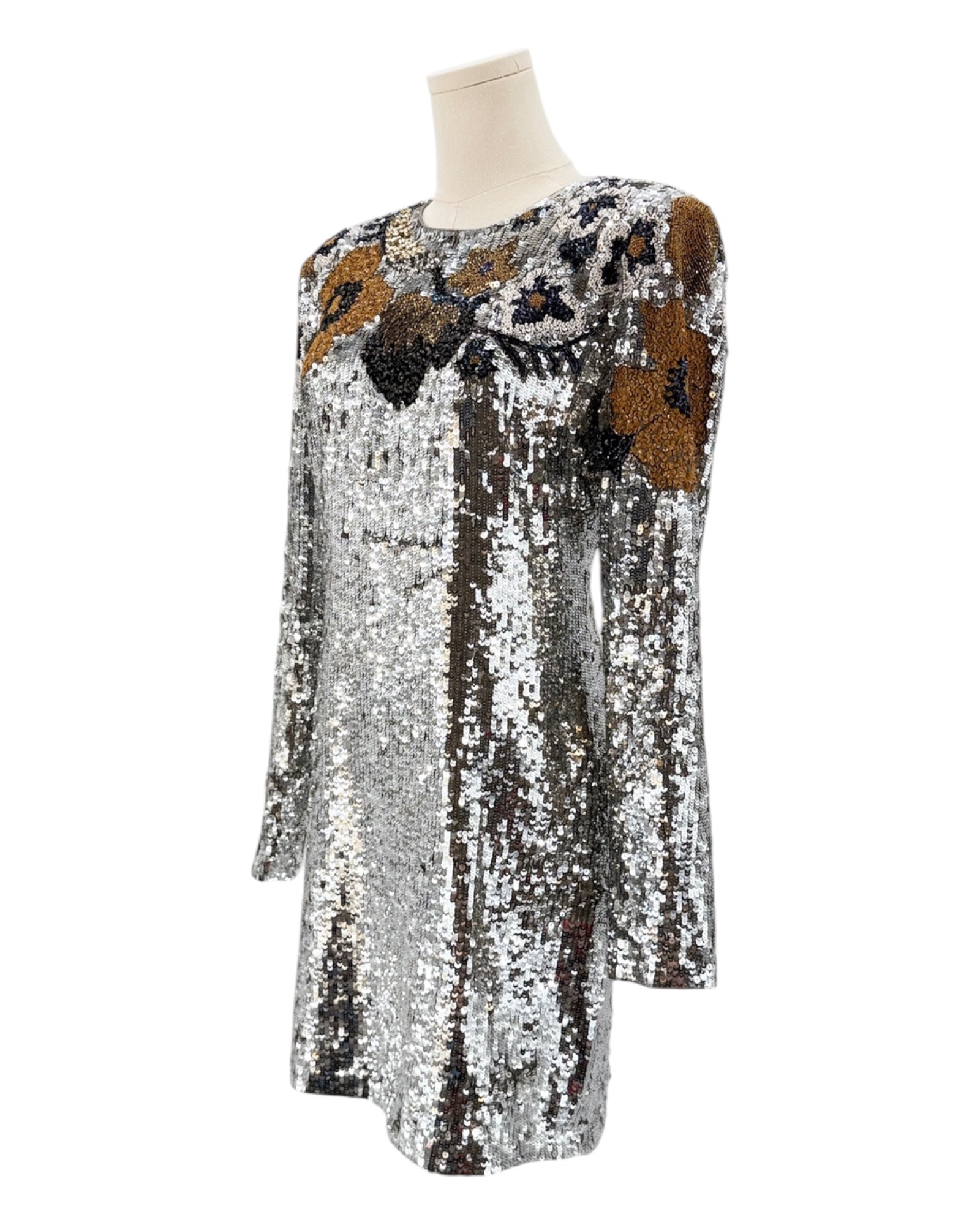 Silver sequin dress with floral patterns on a mannequin against a white background