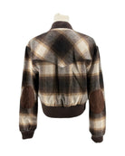 Plaid jacket with brown and beige pattern on a white background