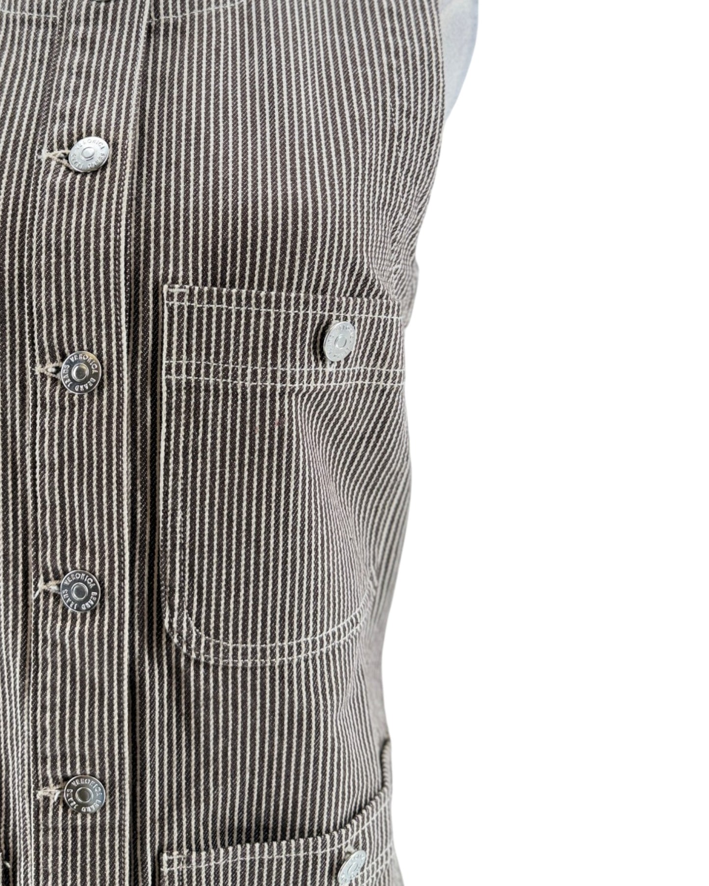 Close-up of a black and white striped jacket with button details on a white background